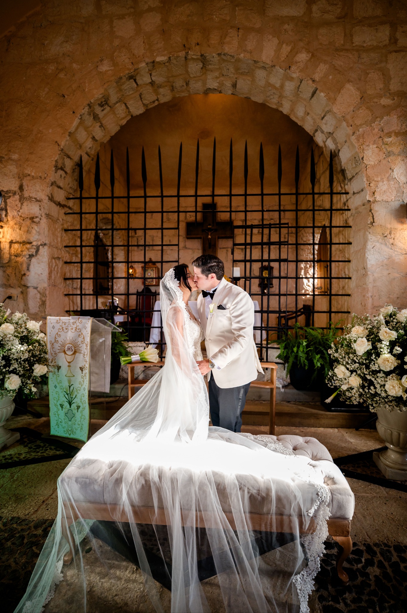 Newlyweds inside a stone chapel at Altos de Chavón