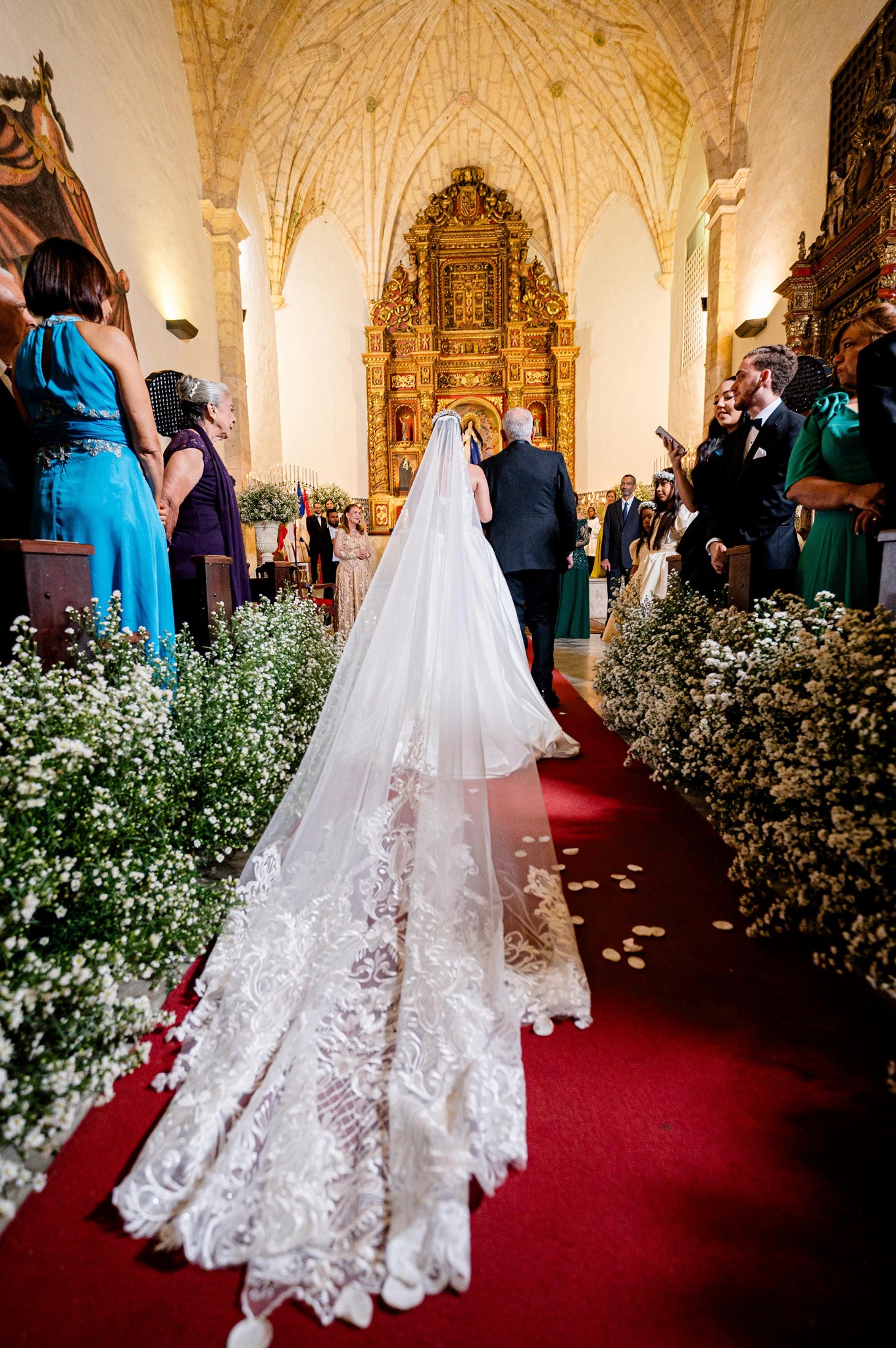 Bride entering a historic church in Santo Domingo